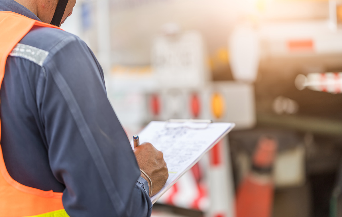 A man reviewing paperwork for apportioned plates in El Paso.